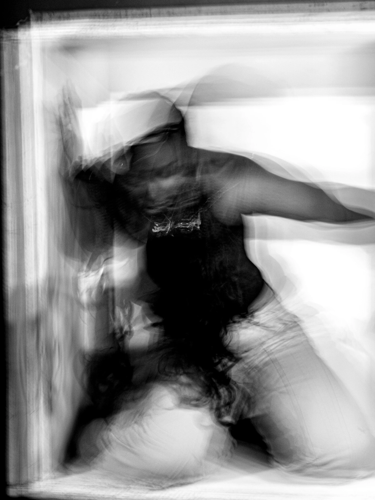 Model standing in a booth