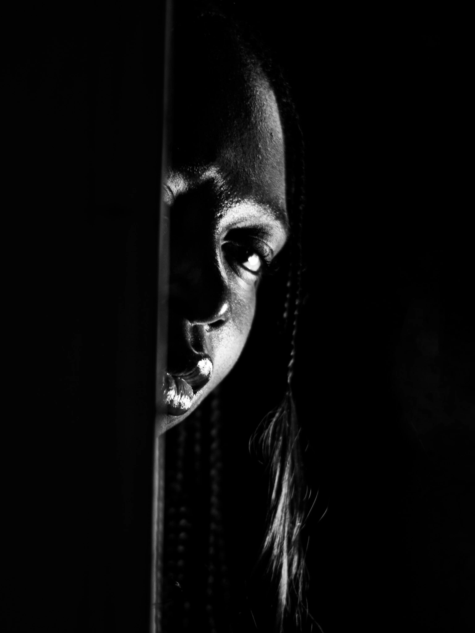 Model standing in a booth