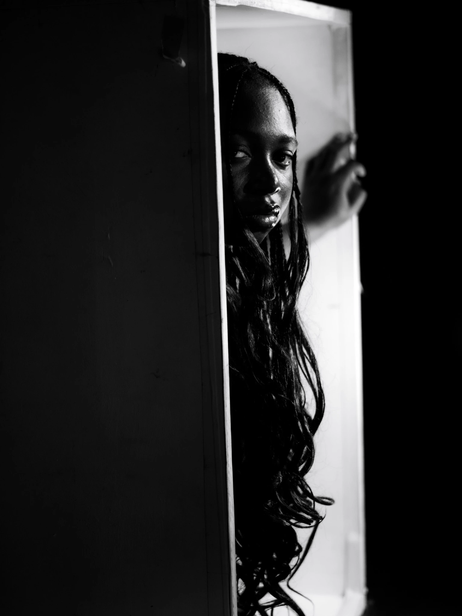 Model standing in a booth