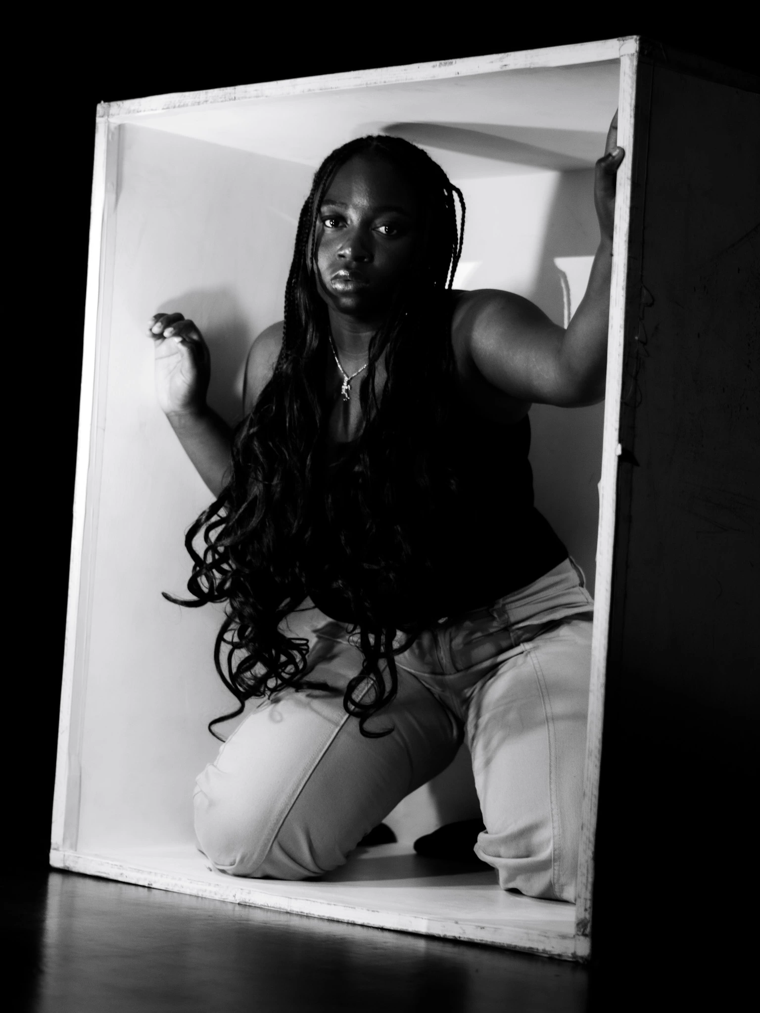 Model standing in a booth